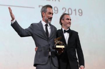  American director Todd Phillips (L) celebrates with actor Joaquin Phoenix after Todd Phillips' film "Joker" winning the Golden Lion for best film at the 76th Venice Film Festival in Venice, Italy, on Sept. 7, 2019. The film "Joker" by American director Todd Phillips won the Golden Lion at the 76th Venice Film Festival on Saturday. (Xinhua/Cheng Tingting/IANS)