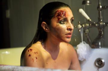 Actress Parineeti Chopra gave a sneak peek of her "intense" look from her upcoming film the Hindi remake of Hollywood thriller "The Girl On The Train".Parineeti on Wednesday took to Twitter to share her first look, which she described as "most difficult". In the new still, she appears heavily bruised, sitting in a bath tub with an expressions of shock on her face.
