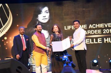 Panaji: Union Environment, Forest and Climate Change and Information and Broadcasting Minister Prakash Javadekar and Goa Chief Minister Pramod Sawant confer the Lifetime Achievement Award on French actor Isabelle Huppert, at the Opening Ceremony of the 50th International Film Festival of India (IFFI-2019) in Panaji, Goa on Nov 20, 2019. Also seen Information and Broadcasting Secretary Amit Khare. (Photo: IANS/PIB)