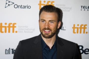 TORONTO, Sept. 13, 2014 (Xinhua) -- Director and actor Chris Evans poses for photos before the world premiere of his directorial debut "Before We Go" at the Princess of Wales Theater during the 39th Toronto International Film Festival in Toronto, Canada, Sept. 12, 2014. (Xinhua/Zou Zheng/IANS)