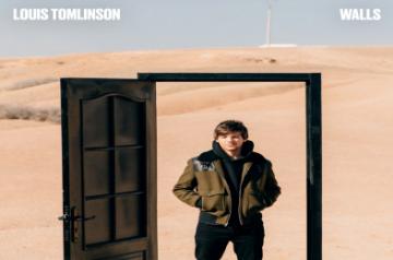 Singer Louis Tomlinson has returned with a new song, "Walls", which reflects on parting ways with a lover. He says he pretends not to be romantic, but he is.