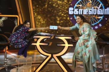 31- year-old Kousalya Kharthika who has become the first ever differently-abled woman to bag the jackpot prize money of Rs 1 crore on "Kodeeswari" -- Tamil version of the reality game show "Kaun Banega Crorepati", receives the cheque from Radikaa Sarathkumar.