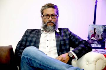 Director H.E. Amjad Khan.