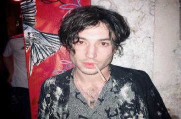 Ezra Miller appears to throttle, shove female fan in video.