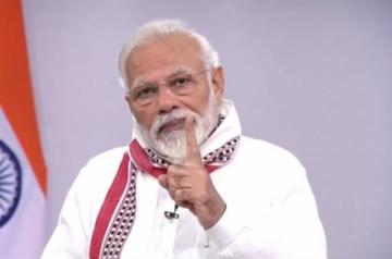 New Delhi: Prime Minister Narendra Modi addresses the nation on the issues related to COVID-19 and existing lockdown, in New Delhi on Apr 14, 2020. The PM on Tuesday commended people of the nation for celebrating festivals by staying at home during the lockdown period. In his address to the nation, Modi announced that based on the suggestions of the state governments and experts, the nationwide lockdown has been extended till May 3. Earlier, a 21-day lockdown was imposed in the country which was