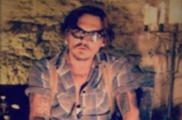 Los Angeles, May 26 (IANS) Actor Johnny Depp has finally completed a wine bottle painting that he had started 14 years ago.