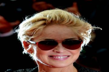 CANNES, May 21, 2014 (Xinhua) -- Sharon Stone arrives at the red carpet for the screening of the film "The Search" at the 67th Cannes Film Festival in Cannes, southern France, on May 21, 2014. (Photo: Xinhua/Chen Xiaowei/IANS)