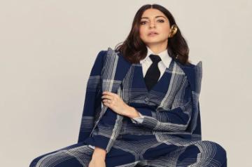Actress Anushka Sharma took to Instagram to make a statement with her plaid jumpsuit look with formal twist, leaving actors Ranveer Singh and Arjun Kapoor gushing about her fashionable outing.