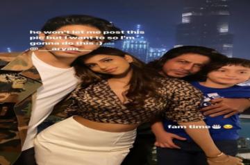 Suhana Khan poses with dad SRK, brothers Aryan and AbRam.