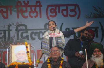 New Delhi: Actress Swara Bhaskar addresses a gathering of farmers during their protest against the Centre's three new contentious farm laws; at the Tikri Border on Jan 9, 2021. (Photo: Bidesh Manna/IANS)