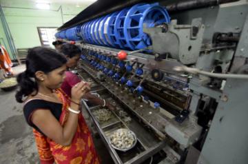 Dharmanagar: Women busy working at a Sericulture unit in Dharmanagar of Tripura on June 10, 2015. (Photo: IANS)