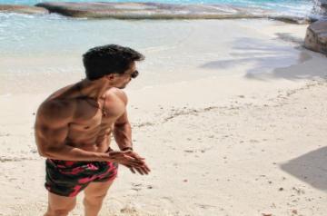 Tiger Shroff goes shirtless on the beach.(Photo:Instagram/IANS)
