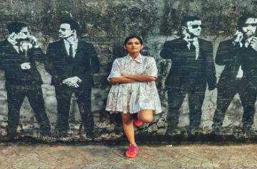 Kubbra Sait shares a cool picture against a wall mural