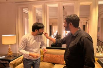 Maanaadu producer feeding Cake to Simbu; Rajini congratulates Maanaadu producer.