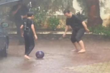 Aamir Khan plays football with son Azad in rain