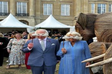 King Charles III & Queen Camilla wear the masks at an event for the Elephant Family